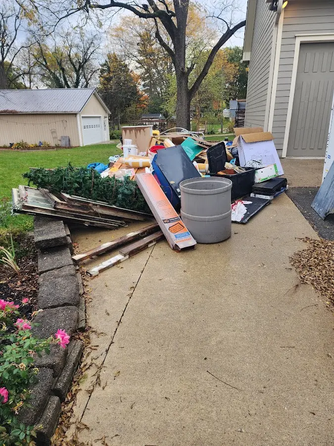 Dumpster being loaded with debris for Residential Dumpster Rental in Bowie